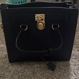 MICHAEL Michael Kors Black Tote w/ Gold Accents. Used but come w/ bag protector